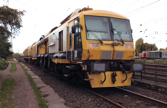 A train dynamically milling a railway line.